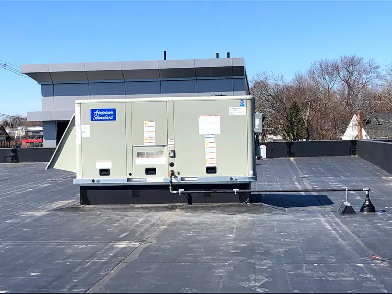 Packaged HVAC unit on a commercial rooftop.